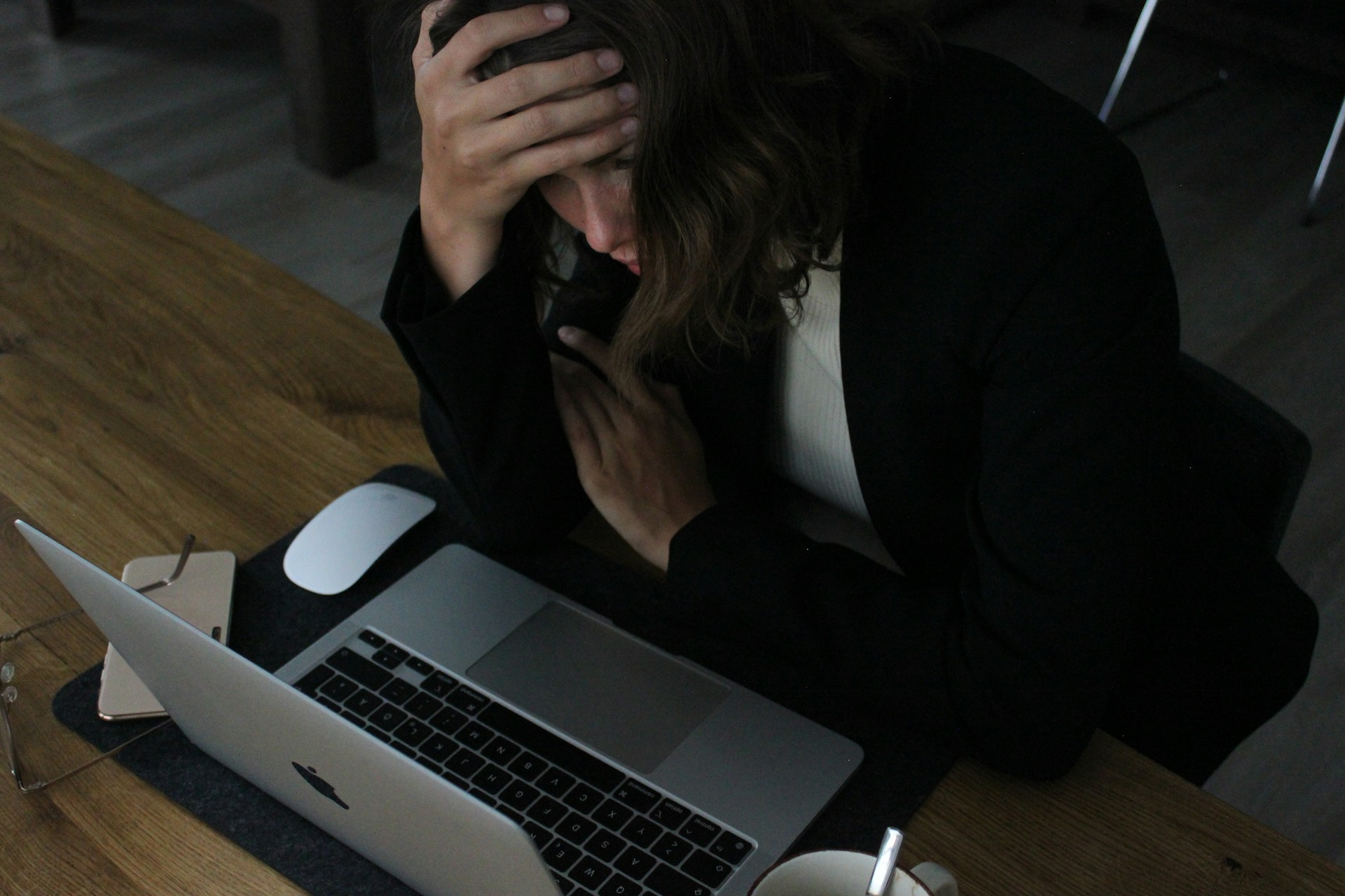 employee burnout stressed at her laptop